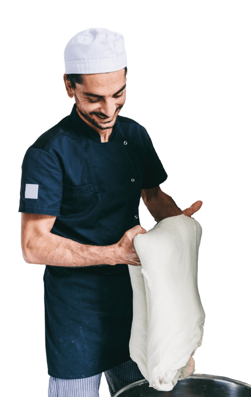 Pizzaïolo étirant une pâte à pizza